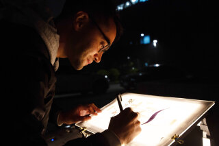 Michael Ang writing on the Infl3ctor for Digital Calligraffiti at the Media Architecture Biennale in Beijing